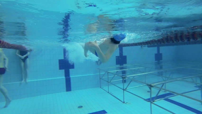 Beautiful underwater slow motion view of swimming backstorke style