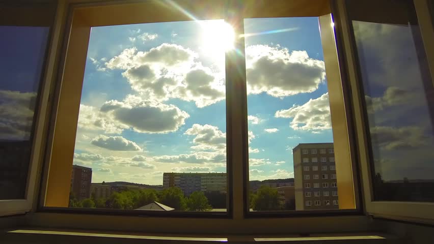 The sun shines through the open window
