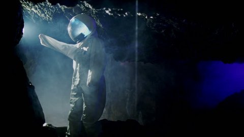 Space science fiction. An Astronaut (or Alien) in dark cave structure. A fantasy science fiction film of epic proportions.