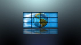 Digital animation of planet earth rotating, viewed on a bank of video screens. High quality HD video footage