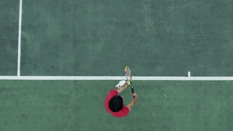 Tennis serve in slow motion from overhead angle. Shot on RED Epic at 240 fps