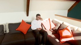 Attractive Indian businessman with nice lifestyle working in his contemporary home. High quality HD video footage