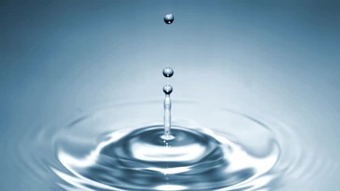 A drop of Water splashes on a clear blue water surface in Slow Motion. High Speed at 1000fps