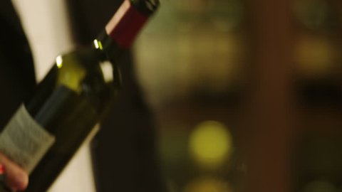 Sommelier Filling Glass with Wine in Restaurant. Close-UP. Shot on RED Digital Cinema Camera in 4K (ultra-high definition (UHD)), so you can easily crop, rotate and zoom, without losing quality!