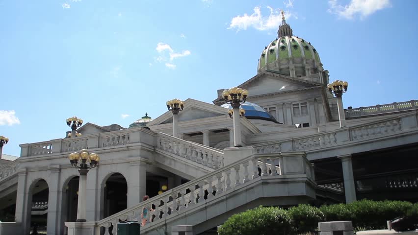 A woman walks up the steps at the capitol building in Harrisburg, Pennsylvania.