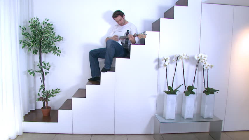 Happy young couple spending time together in their luxury home 