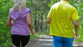 Active couple starting their day with jogging to keep fit