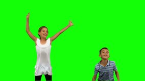 Brother and sister jumping together on green screen in slow motion - Powered by Shutterstock - Get 15% off with code: PIKWIZARD15