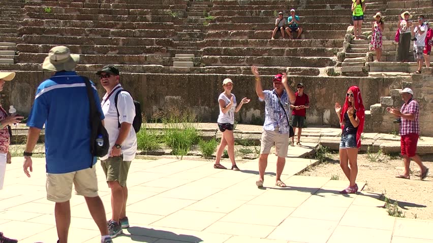 EPHESUS, TURKEY - AUGUST 15: Tourists visiting the Anfi Theatre of Ephesus