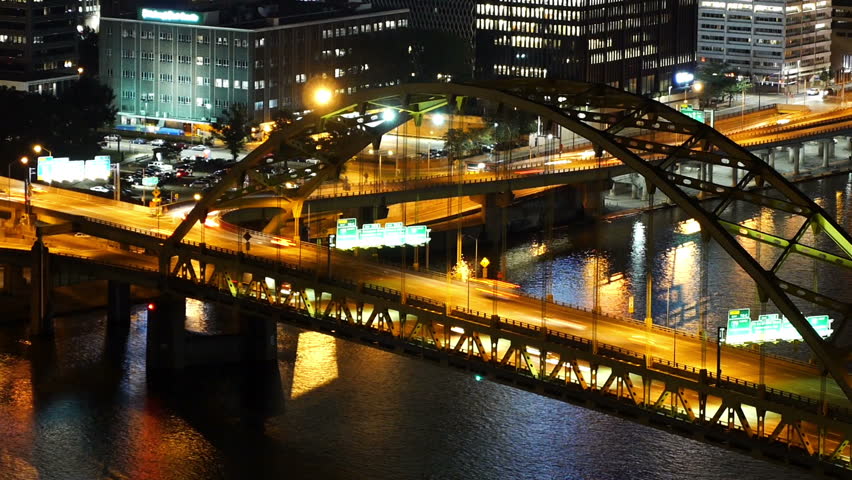 A dramatic time lapse view of traffic passing over the Fort Pitt Bridge in