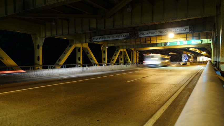A dramatic time lapse shot of traffic traveling over the Fort Pitt Bridge in
