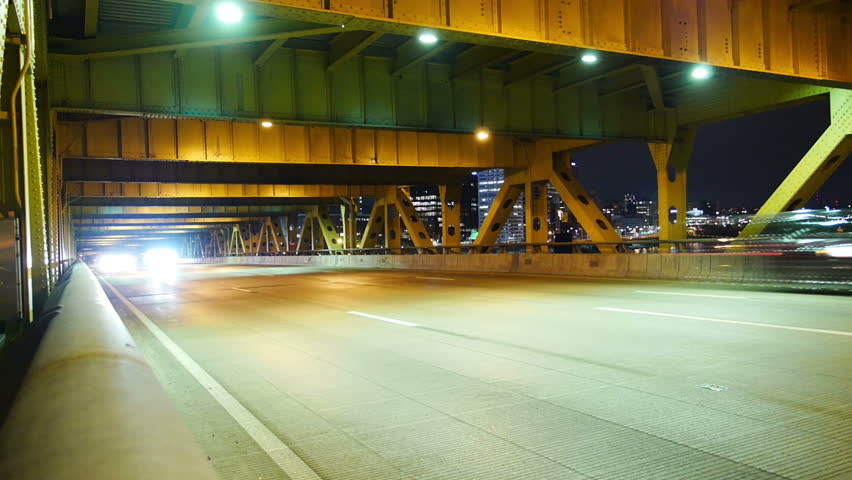 A dramatic time lapse shot of traffic traveling over the Fort Pitt Bridge in