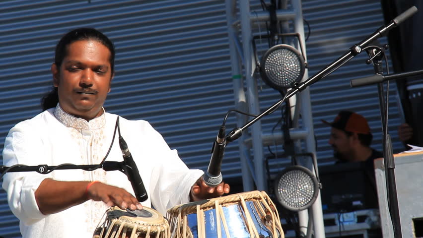 MISSISSAUGA, CANADA - AUG 2013: Indian musician performing on a tabla at a