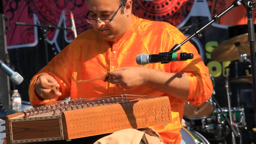 MISSISSAUGA, CANADA - AUG 2013: Indian musician performing on a santoor at a