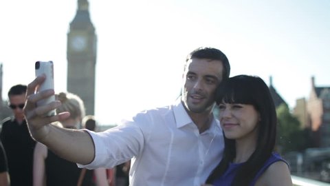 Couple on holiday in London take photo of themselves