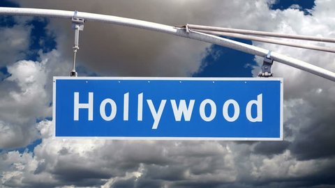Hollywood Bl street sign with moving clouds time lapse.