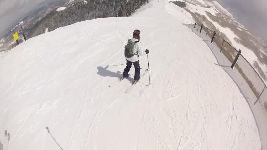 A man skiing at a mountain resort 