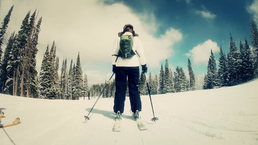 A man skiing at a mountain resort 