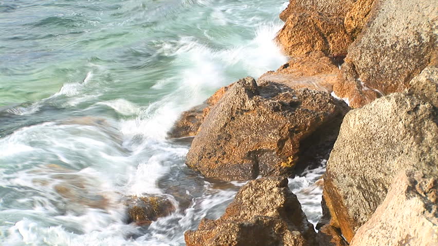 Waves fight about rocks in Black sea for a background