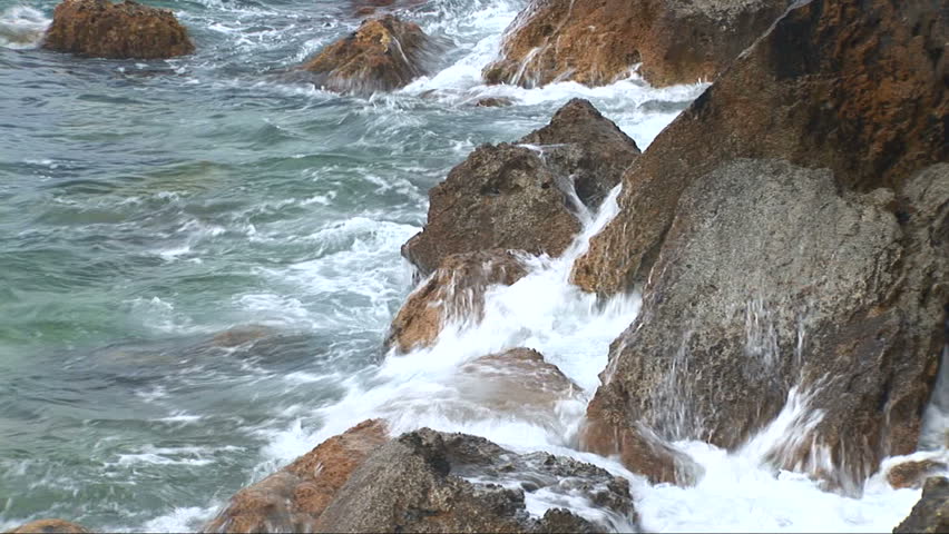 Waves fight about rocks in Black sea for a background