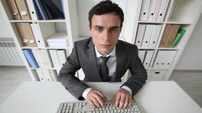 Close-up of a businessman typing fluently with ten fingers