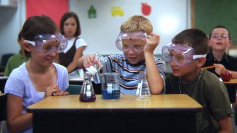 Elementary school students doing a science experiment