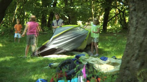 Timelapse shot of kids putting together tent