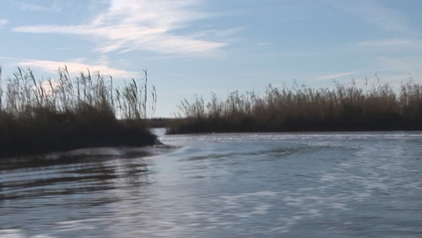 Boats running channels in Louisiana Marsh