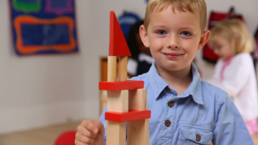 child stacking blocks