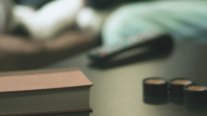 An adorable family sit together and play with a laptop and digital tablet. Close up shot