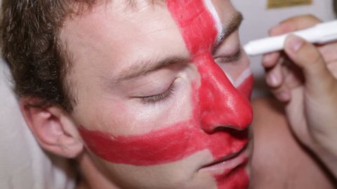 Man face painting flag of United Kingdom