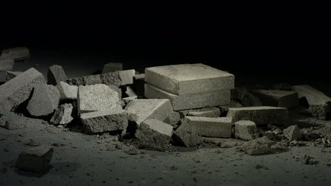Sledge hammer hitting concrete bricks