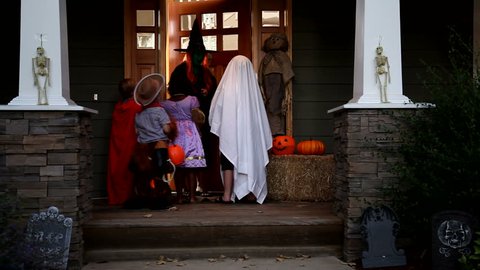 Children in Halloween costumes trick or treating