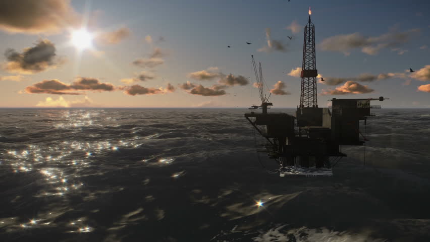 Oil Rig in ocean, timelapse clouds at sunset