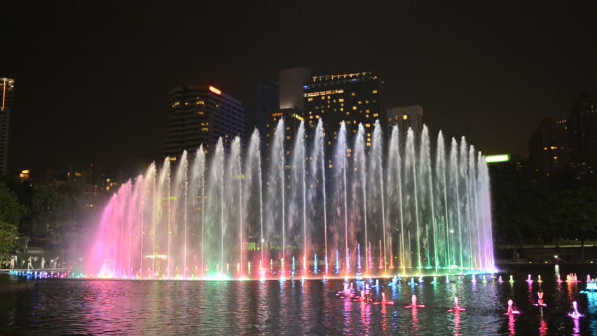 Colored water fountain at night in Kuala Lumpur, Malaysia