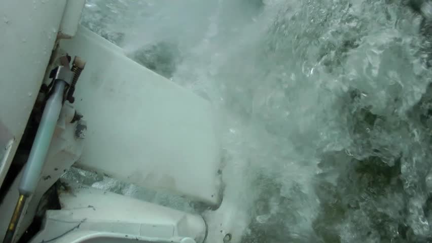 Wake from a sailing boat outboard motor