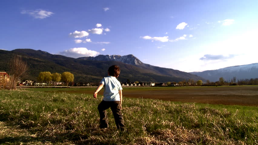 Young boy walking in nature
