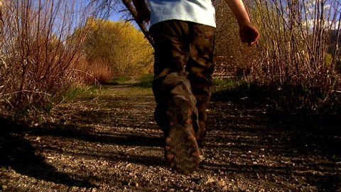 Young boy running in nature Stock Video