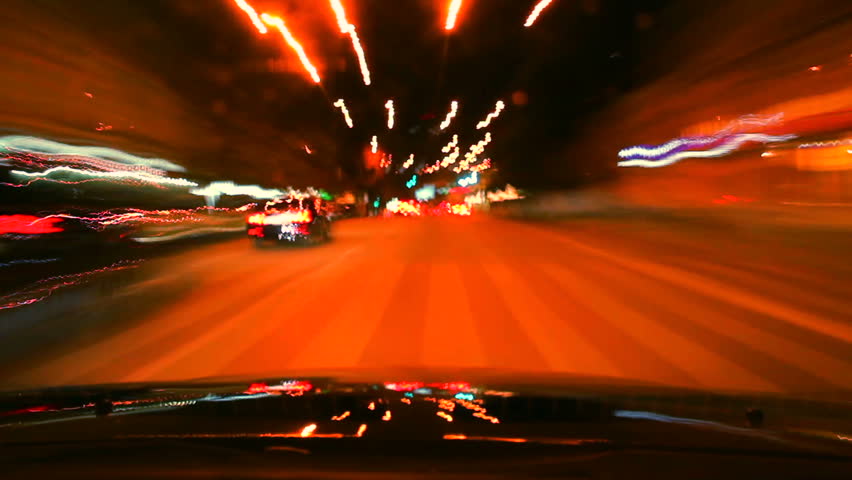 Night car drive around time lapse. Cars leave trace with lights