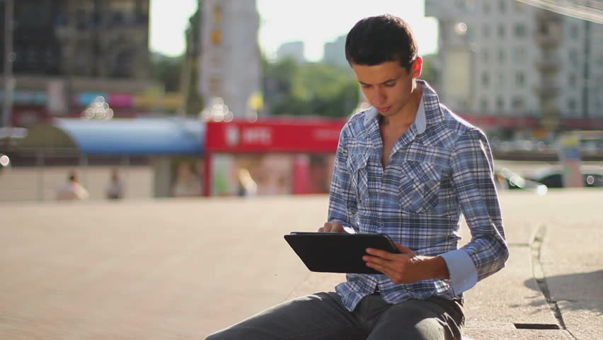 Inspiring information, male browsing tablet pc, getting news