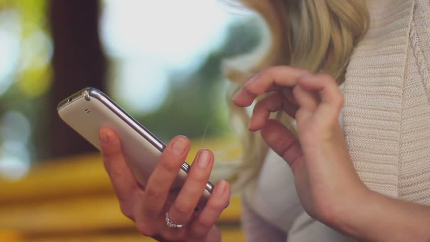 Closeup of young woman hands typing sms scrolling pictures phone Royalty-Free Stock Footage #4573220