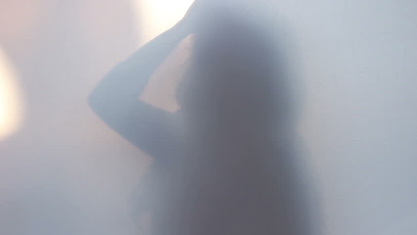 Slim shadow silhouette of woman moving posing acting