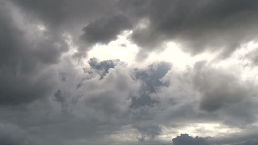 Time lapse during cloudy day with rain clouds forming.