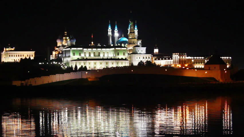 kazan kremlin with reflection in river at night in russia