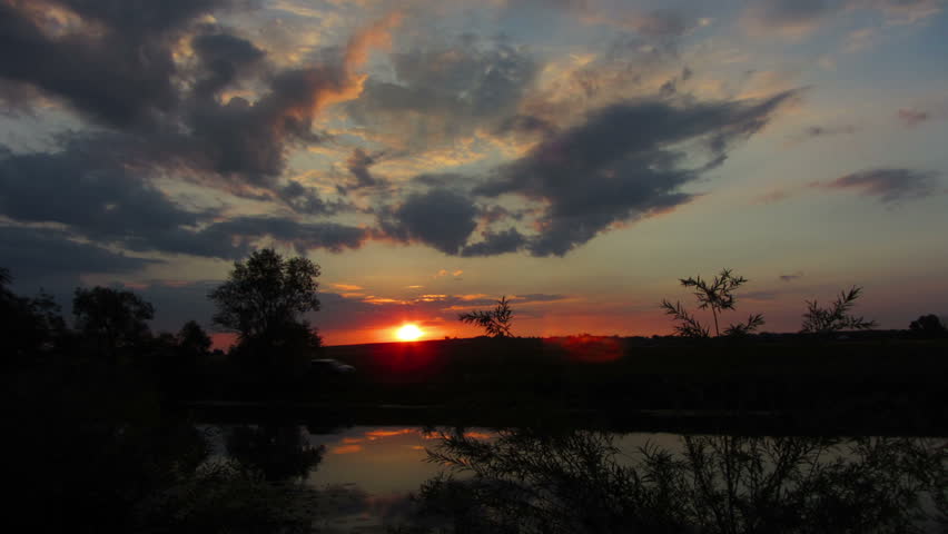 timelapse landscape with sunrise over lake