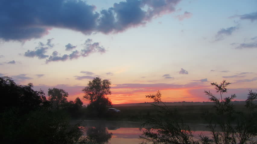 timelapse landscape with sunrise over lake