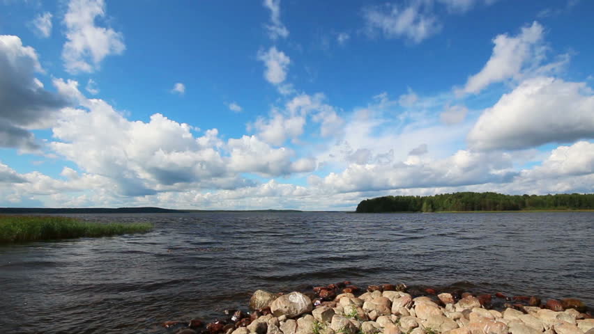 landscape with Vuoksa lake in Russia - timelapse clouds and realtime water