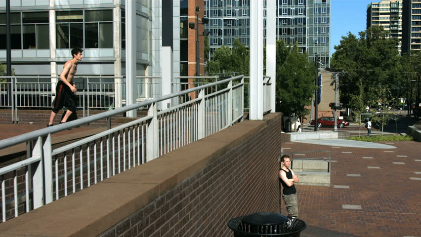 Free runner jumps off wall, slow motion speed ramp
