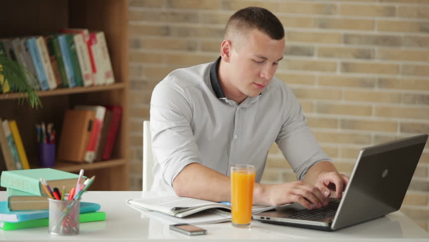 Male Student Sitting at Desk Stock Footage Video (100% Royalty-free