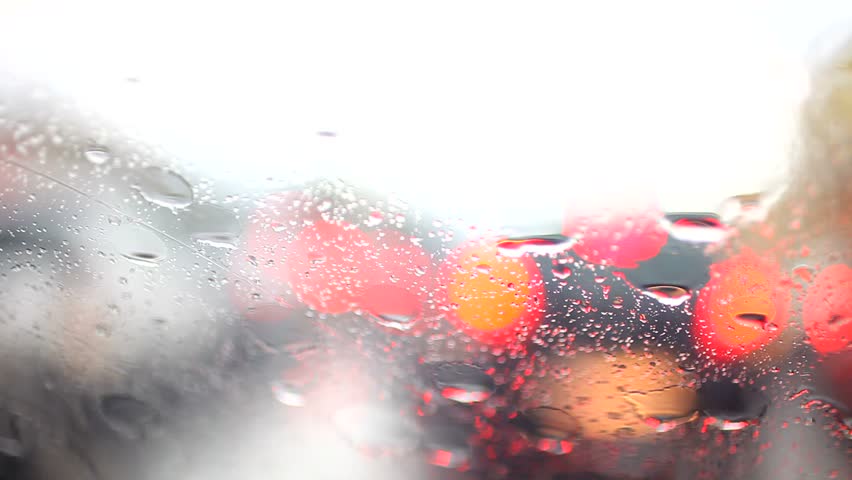 Light Art of Rain drops on the glass when Car  driving 